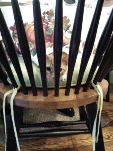 baby oliver in chair-jail with a kitchen Windsor-back chair