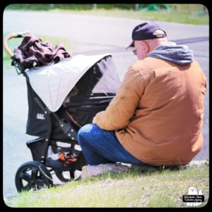 Oliver in his buggy next to The Grumpy Old Man having a conversation