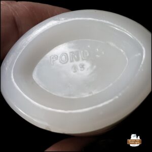 cleaned Pond's "artifact" jar showing the bottom imprint that appears to read "Pond's" and "15"